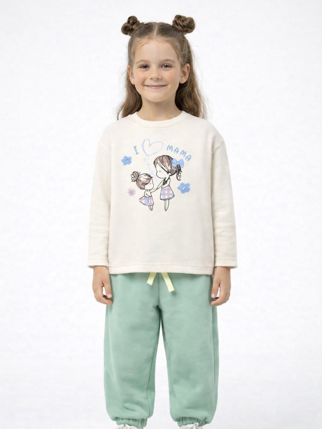 Girl in an “I love mama” sweatshirt and mint Bobonchik joggers